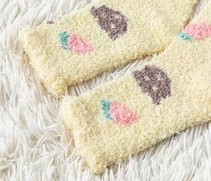 Cozy fuzzy winter warm socks detail shot, soft coral fleece floor sleeping socks design.