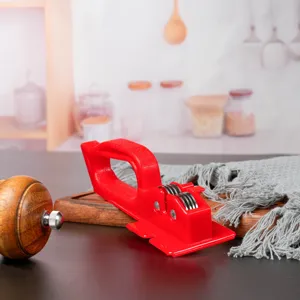 Handheld kitchen knife sharpener with red plastic handle and dual wheels for fast home use.