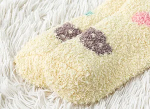 Close-up of thick coral fleece winter warm socks detail showcasing soft fluffy texture.