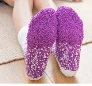Close-up detail of fluffy purple gradient fuzzy winter socks showcasing soft coral fleece texture.