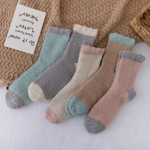 Cozy winter coral fleece colorblock mid-calf socks for women, thick sleep socks and home wear.