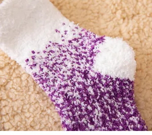 Close-up detail of winter plush coral fleece socks, soft fluffy texture, cozy sleep sock.