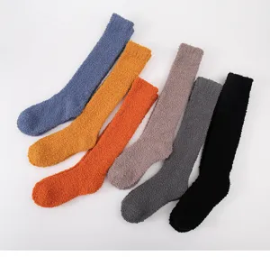 Close-up details of soft coral fleece long socks, cozy thermal sleep socks in multiple colors.