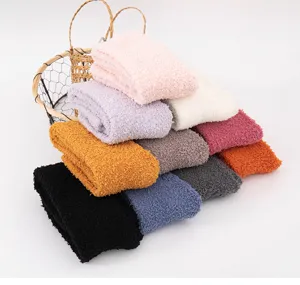 Cozy coral fleece winter socks for women, thick plush sleep socks in assorted vibrant colors.