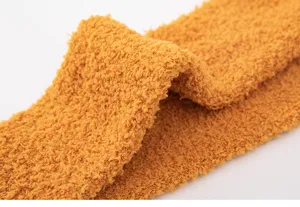 Winter warm coral fleece socks soft fabric close up view cozy fluffy sleep socks material