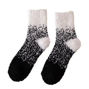 Cozy winter coral fleece fuzzy socks with stylish black and white gradient design for home use.
