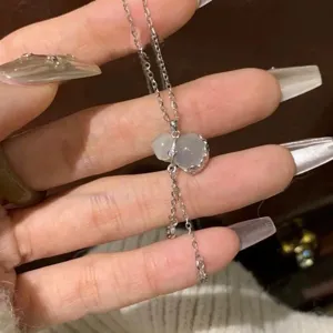 Exquisite imitation chalcedony gourd pendant necklace with delicate tassel chain for women.