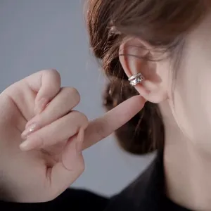 Detailed close-up of a chic double layer rhinestone geometric ear cuff highlighting the wave design.