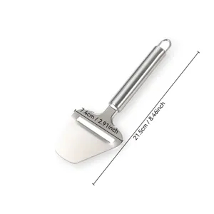 Detail view of stainless steel cheese slicer, ergonomic handle kitchen tool for home use.