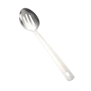 Close-up detail of the stainless steel slotted spoon showing drainage slots and handle hole.