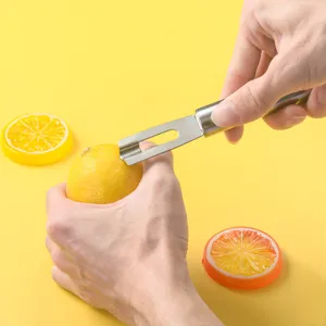 Herramienta rallador de limón de acero inoxidable con mango para pelar cítricos fácilmente.