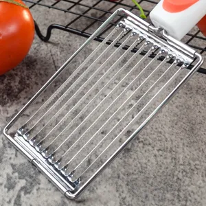 Stainless steel kitchen slicer detail view, showing multi-wire cutting blades for tomatoes and meat.