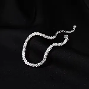 Minimalist sparkling starlight silver chain bracelet for women, niche luxury jewelry design.