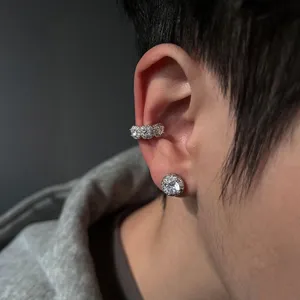 Detailed close-up view of a sparkling cubic zirconia ear cuff and stud earring set.