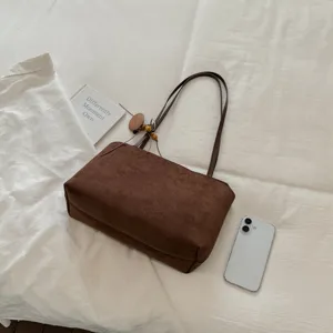 Retro brown suede shoulder bag for women, large capacity underarm tote bag with chic details.