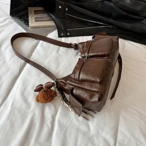 Brown multi-pocket faux leather shoulder crossbody bag with cute bear charm for women.