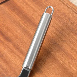 Close-up view of durable stainless steel kitchen tool handle with hanging ring design.