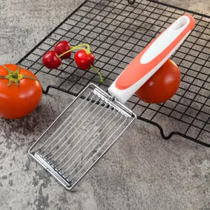 Stainless steel food slicer detail showing multi wire blade design for tomatoes and ham.