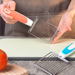 Stainless steel tomato and luncheon meat slicer detail view, non-slip handle kitchen tool.