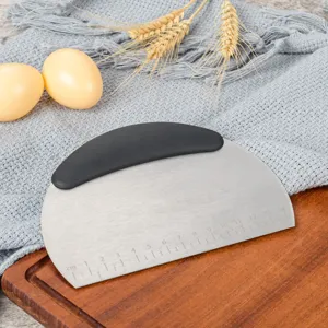 Stainless steel dough scraper with black handle and scale markings for baking preparation.