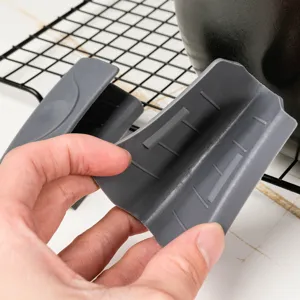 Silicone pot handle cover detail showing anti-scald design and flexible heat resistant material.