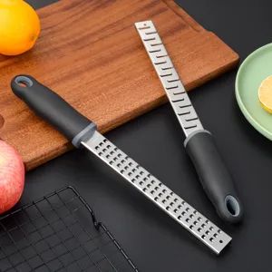 Stainless steel lemon zester and cheese grater with ergonomic handle for kitchen cooking.