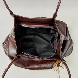 Dark brown large capacity leather tote bag for women, stylish commuting shoulder handbag.