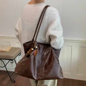 Classic retro brown large capacity leather tote bag, elegant shoulder bag for daily commute.