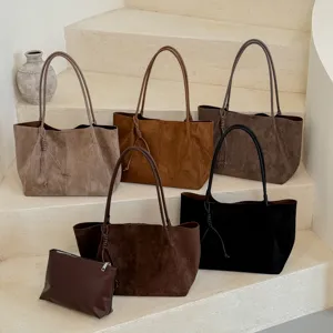 Detail view of large capacity suede tote shoulder bags in multiple colors neatly displayed.