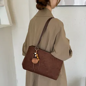Retro brown suede shoulder bag for women, large capacity daily commuter tote bag.