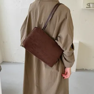 Retro brown suede shoulder bag for women, elegant minimalist underarm tote for daily commute.