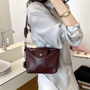 Retro casual women shoulder crossbody bag detail view showcasing minimalist dark red leather.