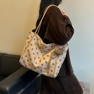Stylish polka dot tote bag for women, large capacity shoulder bag with cute knit heart charm.