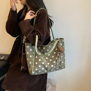 Casual polka dot tote bag with shoulder strap and charm pendant, large capacity for daily commute.