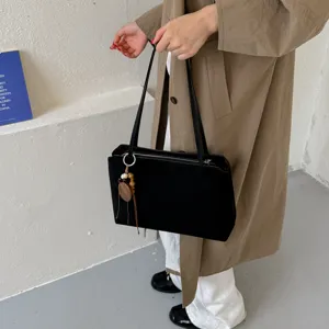 Black PU leather shoulder bag for women, minimalist vintage tote bag with wooden bead charm.