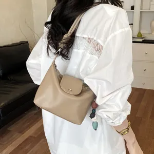 Stylish khaki shoulder bag for women, versatile PU leather crossbody bag with flap and chic bead.