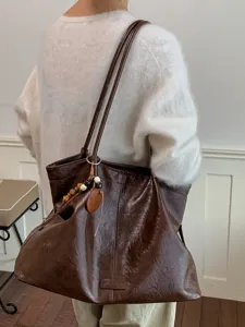 Retro large capacity tote bag for women, stylish vintage shoulder bag for daily commute.