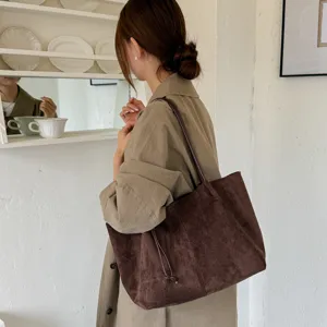 Brown suede tote bag for women, retro commuter shoulder bag detail shot, autumn style.