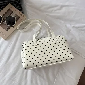 Chic white polka dot bowling bag for women, stylish large capacity shoulder handbag.