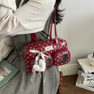 Red polka dot bowling shoulder bag for women with clear front pockets and cute heart charm.