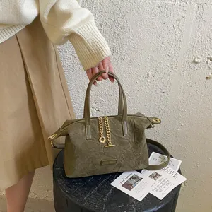Retro suede handbag for women, versatile solid color crossbody bag with metal chain detail.