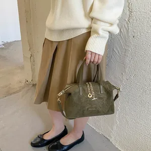 Vintage suede handbag for women, elegant olive green crossbody bag with chain and top handle.