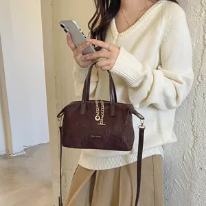 Vintage suede handbag for women, solid color retro crossbody bag with chain and top handle.