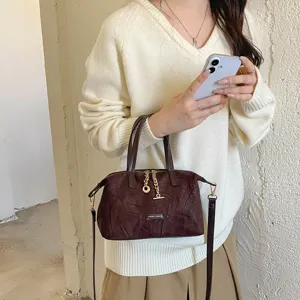 Vintage suede handbag for women, chic solid color crossbody tote with chain charm.