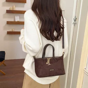 Minimalist brown suede shoulder bag for women, retro casual crossbody handbag with top handle.
