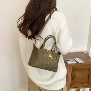 Green suede crossbody bag for women, versatile vintage shoulder tote with chic chain charm.