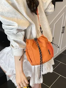 Japanese ins style nylon drawstring bucket bag for women, casual outdoor sports crossbody.