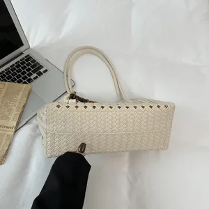 Beige woven tote bag for women, stylish hollow out shoulder bag for daily commuting.