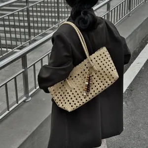 Stylish hollow woven straw tote bag for women, large capacity single shoulder bag.