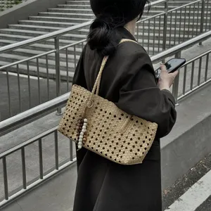 Large capacity woven tote bag for women, stylish hollow out shoulder bag for summer daily commute.